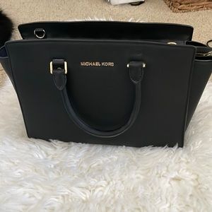 Black big leather Michael Kors handbag in a great condition